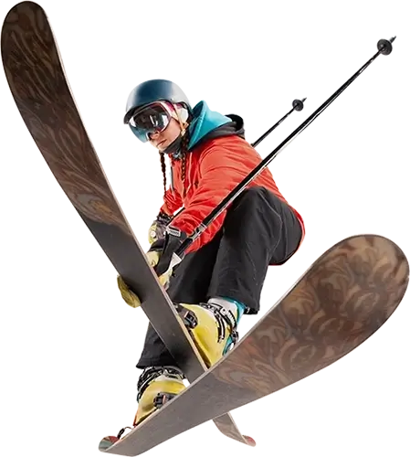 Female skier in an orange jacket crossing their skis and pointing their poles backwards.