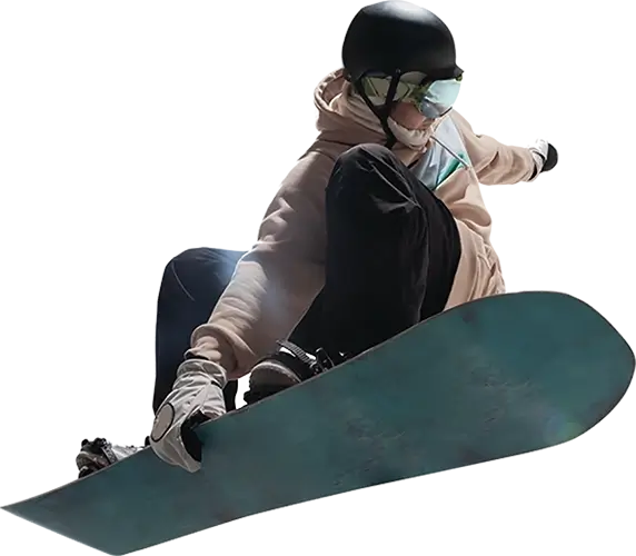 Young adult snowboarder performing an aerial trick by grabbing his board with on hand.